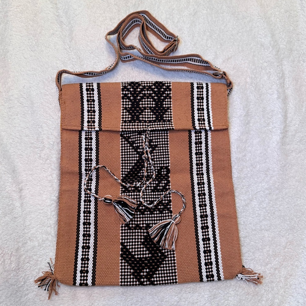 Elegant Tan and Black Woven Backpack